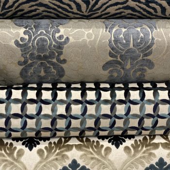 Patterned fabric rolls with various designs.